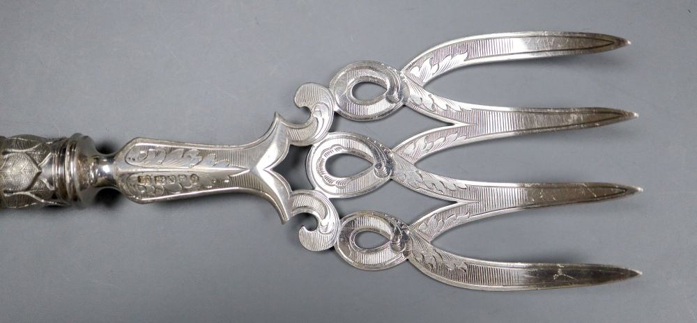 A pair of Victorian carved ivory handled silver fish servers, John Round, Sheffield, 1856, knife, 33.6cm, gross 9.5oz.